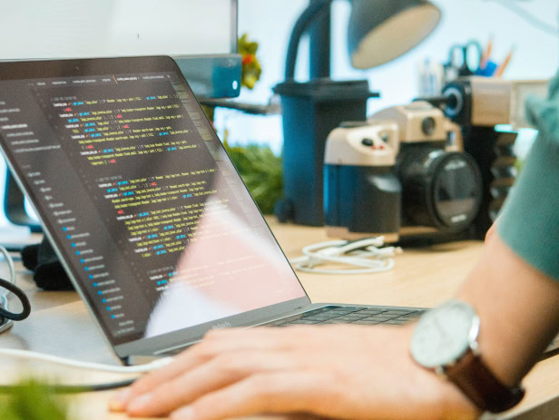 Developer debugging code in his desk